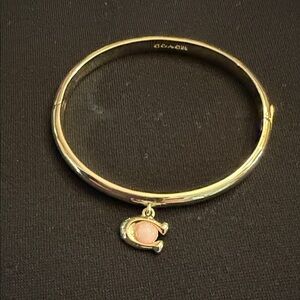 Coach Gold Toned Bangle with Pink Charm